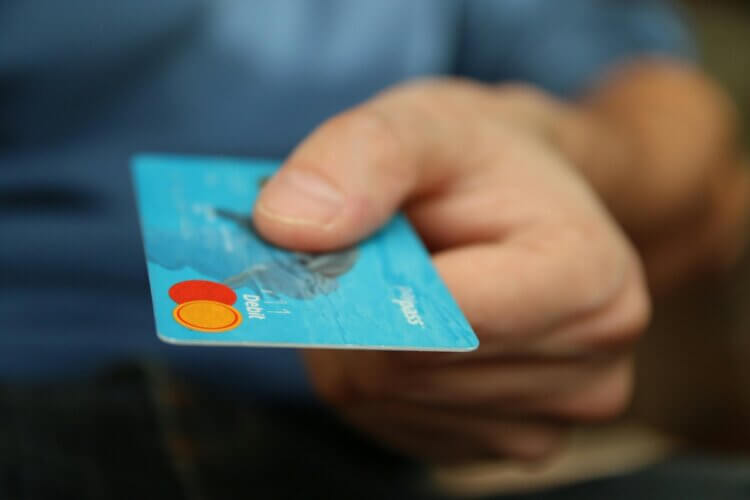 Client holding a debit card